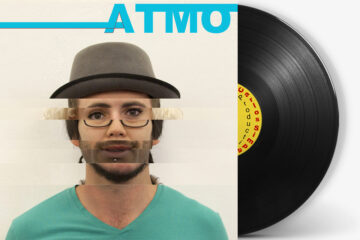 Vinyl cover for “ATMO,” the sixth studio album by Carlos Simpson, featuring a half-portrait of the artist in a minimalist layout with bold typography.