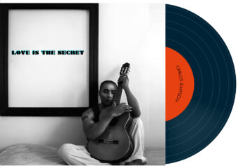 Vinyl album cover for “Love Is the Secret” by Carlos Simpson, released in 2020. Minimalist artwork reflecting themes of love, perception, and emotional depth.