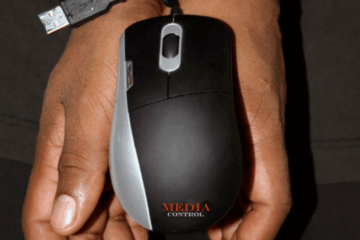 Hands bound with a computer mouse cable symbolizing loss of freedom through media control and digital surveillance, with the question "Do we want this to be a democracy?