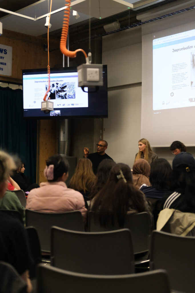 Carlos Simpson speaking to an audience at Central Saint Martins University of the Arts London discussing creativity, judgement, and decision-making